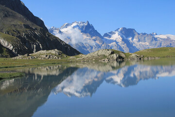 Goleon lake in the french Alps with view on La Meije mountain 
