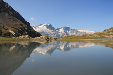 Naklejka na ściany i meble Goleon lake in the french Alps with view on La Meije mountain 