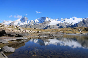 Fototapeta na wymiar The black lake in the plateau of Emparis in the french alps
