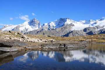 Fototapeta na wymiar The black lake in the plateau of Emparis in the french alps