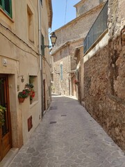 Valldemossa, Mallorca, Spain - 05.06.2022: Narrow streets of Valldemossa, Mallorca, Spain