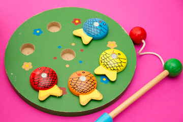 Let's go fishing. Wooden fishes and fishing rod with magnet on the tip. Early education, counting...