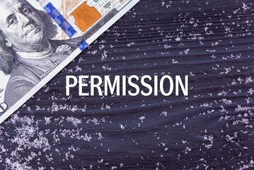 PERMISSION - word (text) on a dark wooden background, money, dollars and snow. Business concept (copy space).