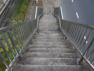 Top view of stairs of the pedestrian overpass in the city