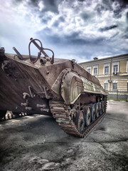 Old army tank standing in a town square