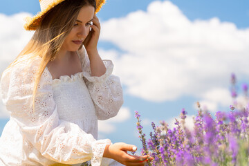 Summer portrait of a young woman with purple lavender