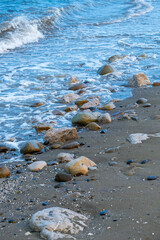 Detail of the sea waves reaching the beach.