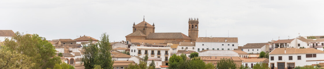 Fototapeta na wymiar Amazing panoramic view at the Baños de la Encina village, medieval Castle, Mateo church and tower