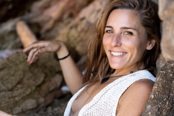 Beautiful Caucasian woman smiling relaxing on summer