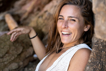 Beautiful Caucasian woman smiling relaxing on summer