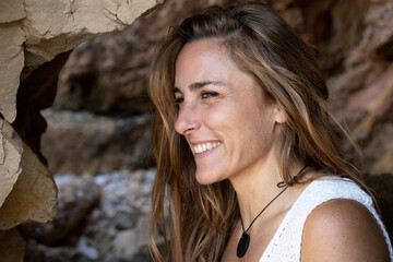 Beautiful Caucasian woman smiling relaxing on summer