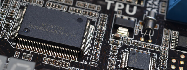 closeup on electronic circuit board with components and semiconductors. long banner web image