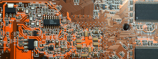 closeup on electronic circuit board with components and semiconductors. long banner web image