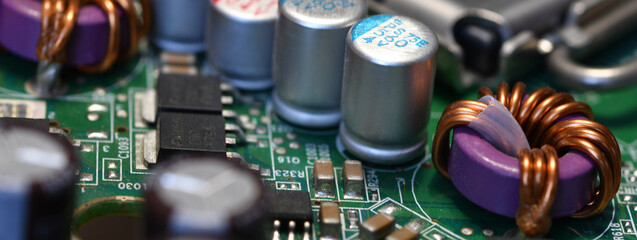 detail of electronic components over computer mainboard. long banner web image