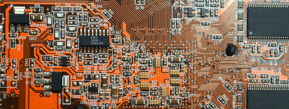 closeup on electronic circuit board with components and semiconductors. long banner web image