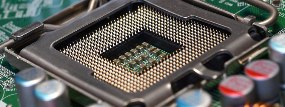Detail of cpu socket on a modern computer motherboard. Electronic small component details. long banner web image
