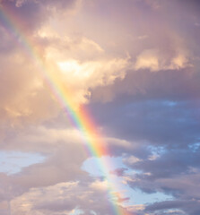 Fototapeta na wymiar amazing bright rainbow in beautiful evening cloudy sky after rain and thunder, weather concept