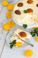 Homemade cheesecake cheesecake with apricots and fresh apricots and mint leaves