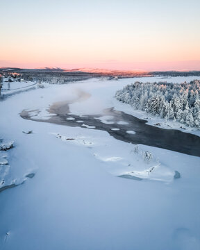 Aerial View of Kattilakoski Rapids on Torne River in Winter, Norrbotten, Sweden.