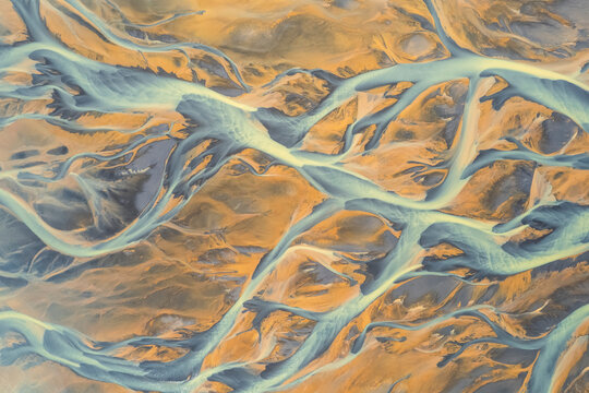 Aerial view of a water abstract pattern from a river estuary in Iceland.