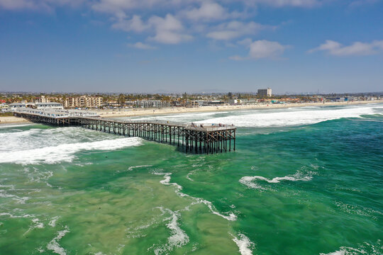 Aerial view of Crystal Pier facing the Pacific Ocean Beach in San Diego, California, United States.