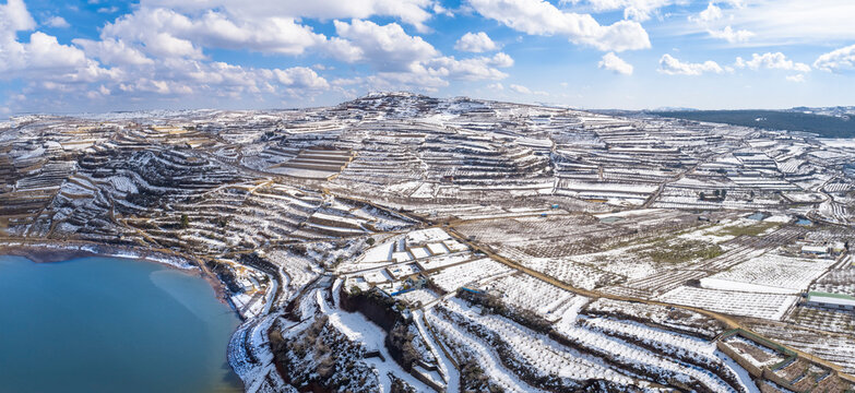 Aerial view of Lake Ram in wintertime with snow, Golan Heights, Israel.