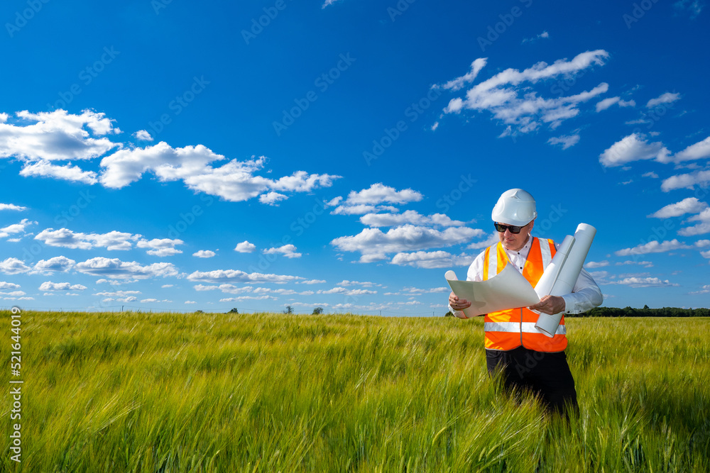 Aufkleber man architect. architect with papers on summer field. man in construction worker uniform. architect 