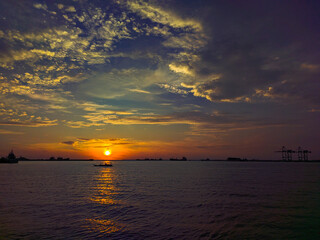 Dramatic photo of sunset sky with clouds. Dramatic photo of sunset over the sea