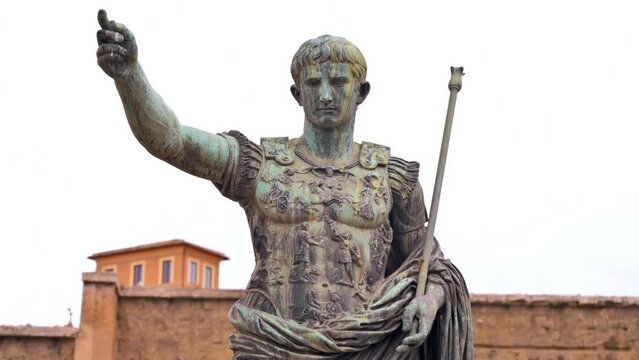 Statue of Julius Augustus Caesar located in the centre of Rome, Italy. Buildings on the background