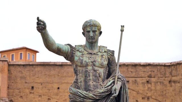 Statue of Julius Augustus Caesar located in the centre of Rome, Italy. Buildings on the background