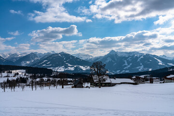Beautiful panorama view of Ramsau am Dachstein village and Schladming with Planai, Hochwurzen and other peaks of Alps in background with blue sky cloud in winter, Austria - 521648213