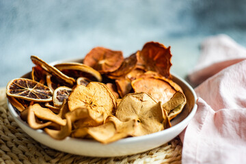 Close-Up of a bowl of dried apple, orange and persimmon chips