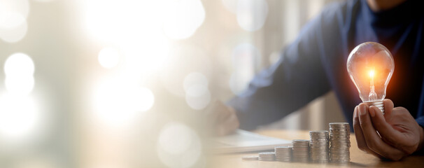 Close up hand choose light bulb or lamp with bright for human resources or leadership and creativity thinking idea motivation or vision and knowledge learning. © kunakorn