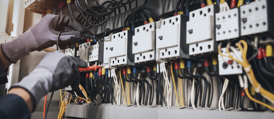 Electricity and electrical maintenance service, Engineer hand holding AC multimeter checking...