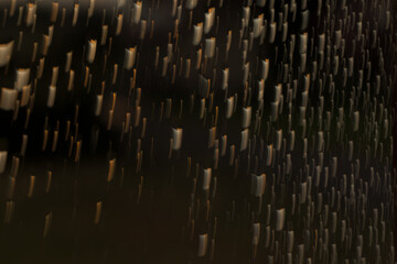 Abstrakcyjne kropelki wody na szybie w trakcie nocnego deszczu © Szymon Chwaliński