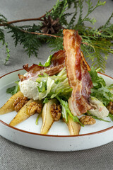 Salad with pear, bacon and walnuts. Haute cuisine, beautiful service.