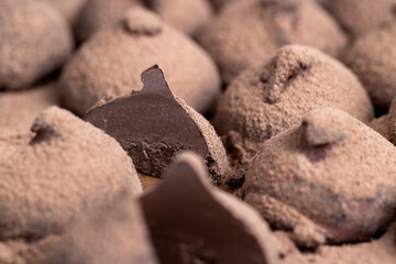 chocolate candies truffles on a wooden board