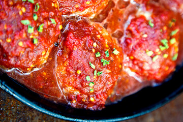 Appetizing fresh meatballs in tomato sauce. Meat dish meatballs in traditional sauce. Meatballs in tomato sauce on the table in a pan. The concept of food, home cooking, haute cuisine.