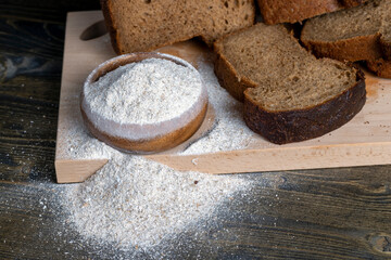 sliced rye bread on a wooden table, close up