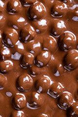 real milk chocolate while cooking with hazelnuts