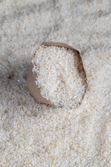 a pile of white rice on the kitchen table in a bag