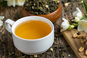 Brewed green tea with jasmine on the table