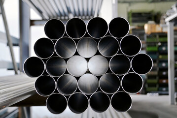 Steel and metal pipes for industrial production. Concept of rising costs of raw materials. New...