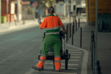 City Service Worker Cleans City Streets