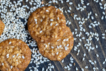 oatmeal thin round cookies with lots of sesame seeds