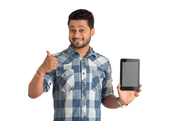 Young handsome man, businessman showing a blank screen of a smartphone or mobile or tablet phone on white background
