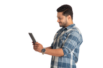 Young handsome man holding and using smartphone or mobile or tablet phone on a white background