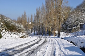 Road under the snow in Brittany