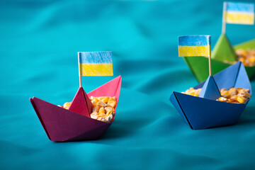 Ships with Ukrainian maize grain made of paper concept