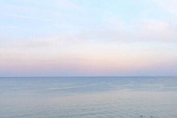 Fototapeta na wymiar Sea side in sunset soft lighting. Soft horizon line before after sunset. Black sea beach
